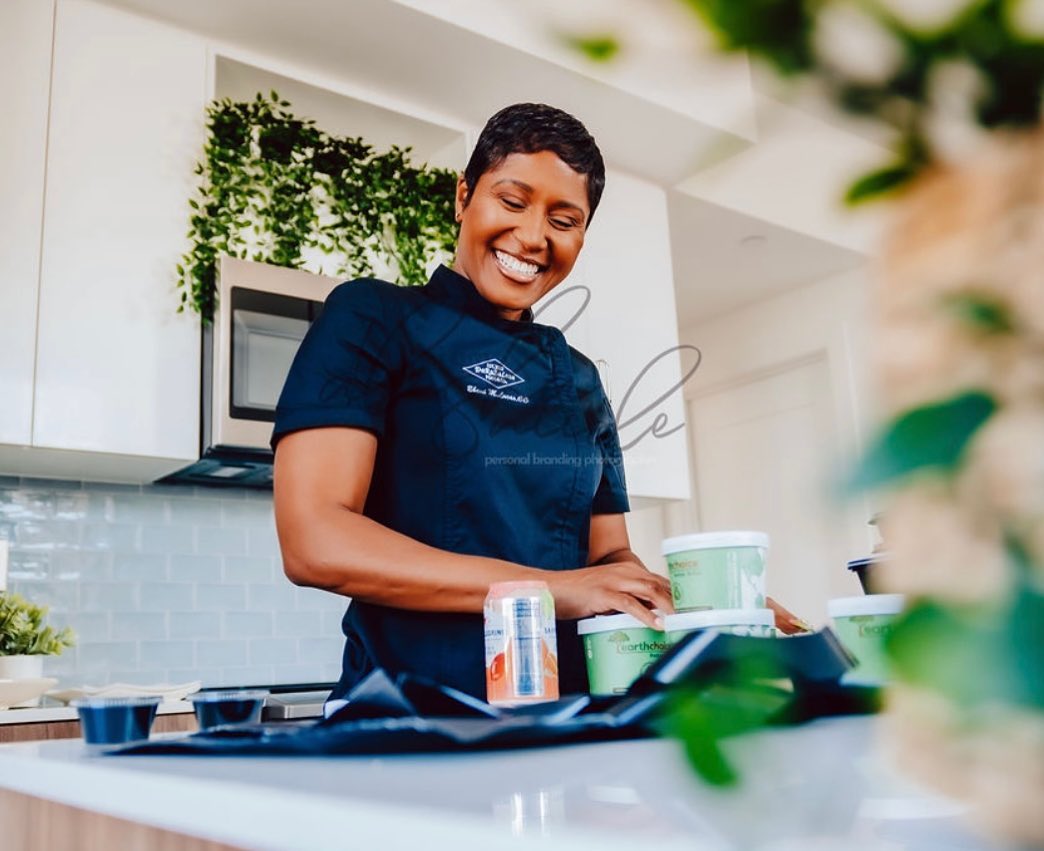 Chef Eboni Darnell Lucas preparing gourmet cuisine in her kitchen
